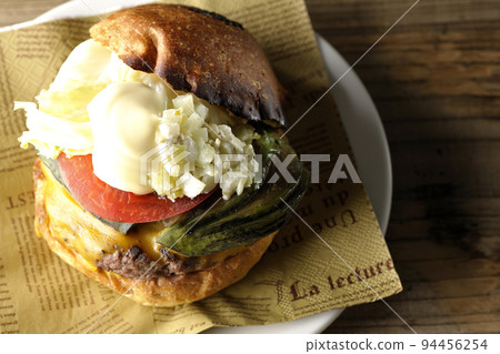 Avocado cheeseburger on a paper napkin Avocado cheeseburger on a paper napkin 94456254