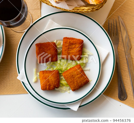 San Jacobo, fried cheese and ham, typical Spanish food 94456376