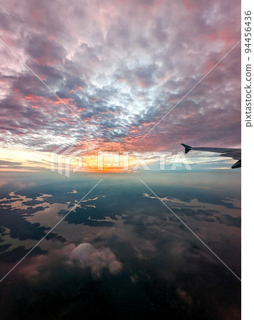 early morning sunrise from an airplane early morning sunrise from an airplane 94456436