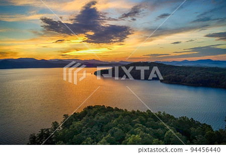 beautiful early morning sunrise on lake jocassee south carolina 94456440