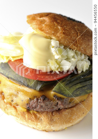 Avocado cheeseburger shot against a white background Avocado cheeseburger shot against a white background 94456550