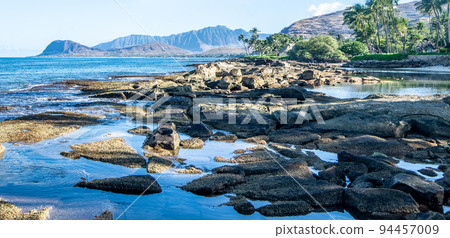 beautiful blue sky and beach scenes on secret beach oahu hwaii 94457009