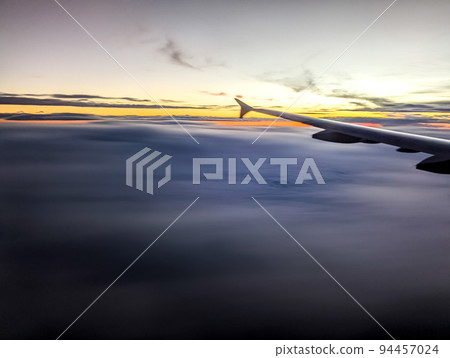 early morning sunrise from an airplane early morning sunrise from an airplane 94457024