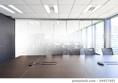 Glass-enclosed conference room with bright light Office interior view Interior business image Glass-enclosed conference room with bright light Office interior view Interior business image 94457485