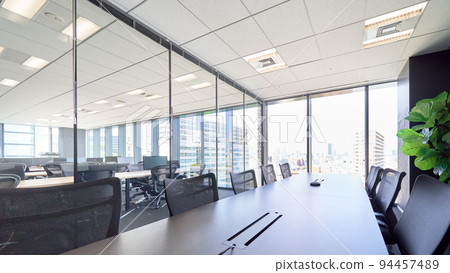 Glass-enclosed conference room with bright light Office interior view Interior business image 94457489