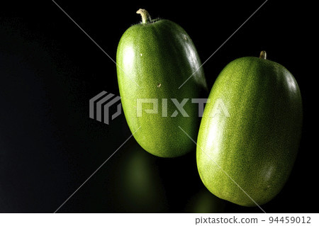 Shoot a winter melon against a black background Shoot a winter melon against a black background 94459012