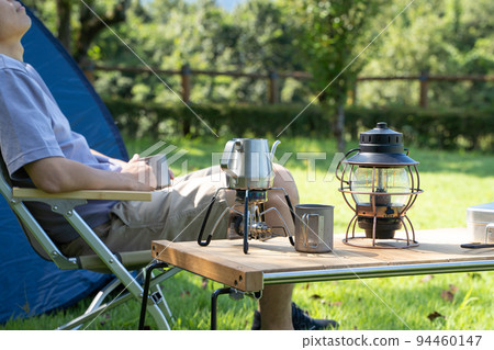 Man relaxing outdoors Man relaxing outdoors 94460147