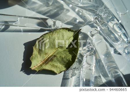 There are a lot of pipettes from cosmetics in one photo. 94460665