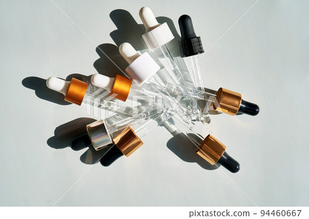 There are a lot of pipettes from cosmetics in one photo. 94460667