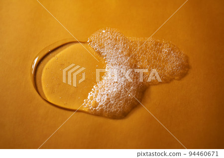 A drop of gel and the texture of the foam. It can be the texture of shampoo, shower gel or dishwashing detergent. 94460671