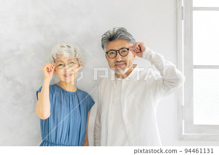 senior couple wearing glasses senior couple wearing glasses 94461131