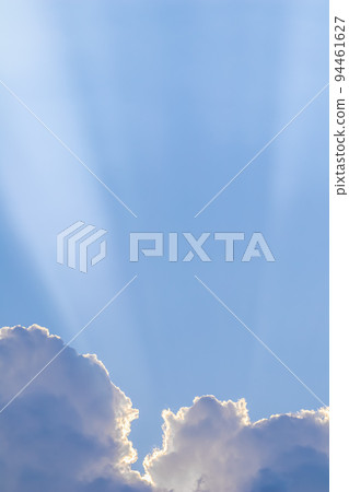 Background from blue sky with sun rays across clouds. High quality photo Background from blue sky with sun rays across clouds. High quality photo 94461627