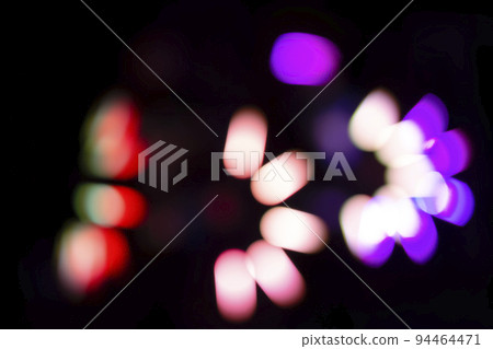 Multicolored defocused bokeh on a black background. Multicolored defocused bokeh on a black background. 94464471