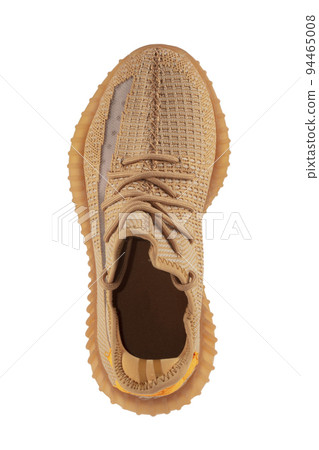 Beige rag sneaker on a white background. 94465008