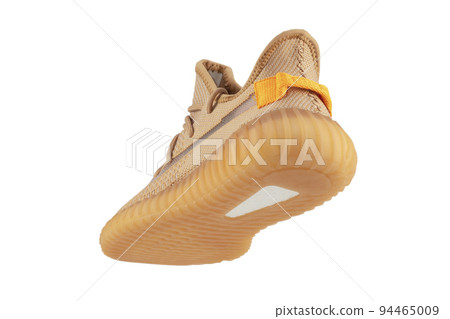 Beige rag sneaker on a white background. 94465009