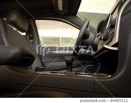 Steering wheel and dashboard in car leather interior side view Steering wheel and dashboard in car leather interior side view 94465111