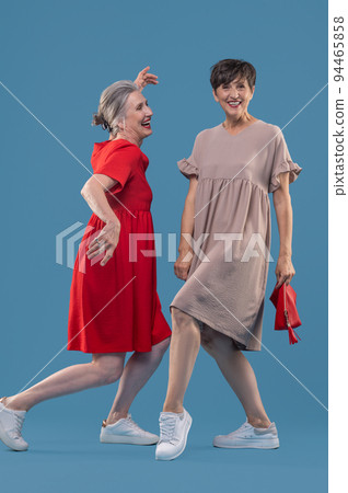 Women in cute dresses having fun and looking happy 94465858