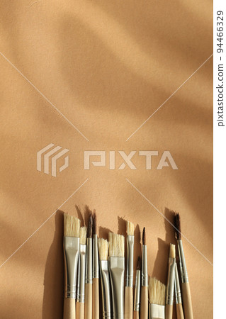 aquarelle painting brush set on brown paper background aquarelle painting brush set on brown paper background 94466329