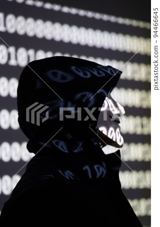 Hooded identity theft wearing an Anonymous Guy Fawkes mask Hooded identity theft wearing an Anonymous Guy Fawkes mask 94466645