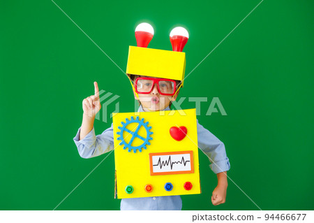 Happy child wearing a robot Happy child wearing a robot 94466677