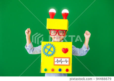 Happy child wearing a robot Happy child wearing a robot 94466679