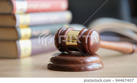 Wooden gavel of judges and law book in courtroom Wooden gavel of judges and law book in courtroom 94467407