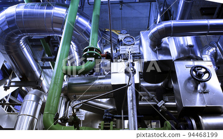 Equipment, cables and piping as found inside of a modern industrial power plant 94468199