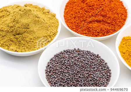 Spices used in curry Powdered spices in a small plate 94469670