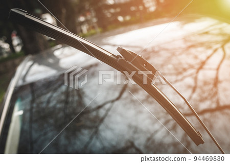 Car wiper raised above the windshield for maintenance Car wiper raised above the windshield for maintenance 94469880