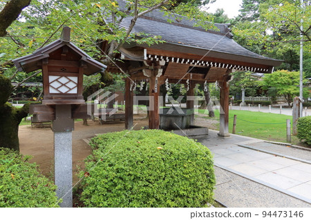 Shinto shrines in Japan : Scenery near the chozuya in the precincts of Takeda Shrine in Kofu City, Yamanashi Prefecture Shinto shrines in Japan : Scenery near the chozuya in the precincts of Takeda Shrine in Kofu City, Yamanashi Prefecture 94473146