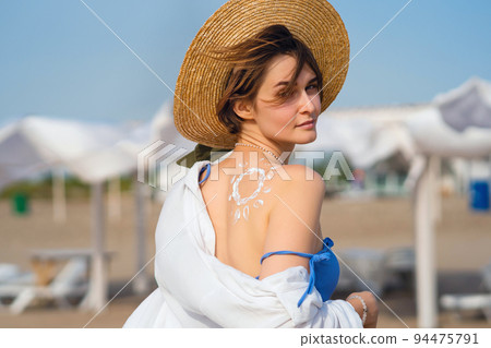 Girl with Sunscreen in form Sun Girl with Sunscreen in form Sun 94475791