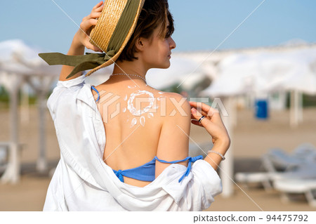 Woman with Sunscreen in form Sun 94475792