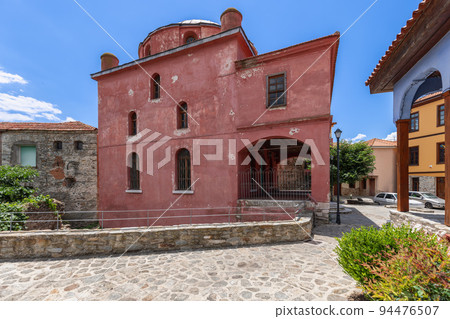 Bright red Khalil Bey Mosque is example of oriental architecture dated middle of 16th century 94476507