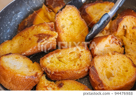 French toast in a frying pan French toast in a frying pan 94476988