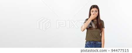 Portrait of young beautiful caucasian funny student girl with long brown hair in fashionable outfit squeezing face with hands. Portrait of young beautiful caucasian funny student girl with long brown hair in fashionable outfit squeezing face with hands. 94477515