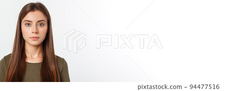 Portrait of a beautiful young woman looking at the camera and smiling, isolated on a white background. Portrait of a beautiful young woman looking at the camera and smiling, isolated on a white background. 94477516