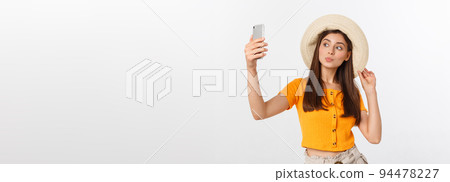 Young Caucasian woman enjoying the selfie with herself isolated on white background summer travel concept. 94478227