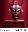 Peruvian Mayan Mask on stand in studio. Multi color. Ancient art. Studio Backdrop. Filmic lighting. Front light. Top light. Directional lighting. 94478608
