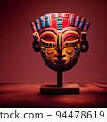 Peruvian Mayan Mask on stand in studio. Multi color. Ancient art. Studio Backdrop. Filmic lighting. Front light. Top light. Directional lighting. 94478619