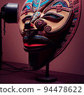 Peruvian Mayan Mask on stand in studio. Multi color. Ancient art. Studio Backdrop. Filmic lighting. Front light. Top light. Directional lighting. 94478622