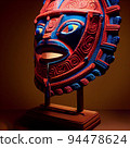 Peruvian Mayan Mask on stand in studio. Multi color. Ancient art. Studio Backdrop. Filmic lighting. Front light. Top light. Directional lighting. 94478624