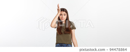 Girl with a suspicious look and hand on her side on a white isolated background. 94478864