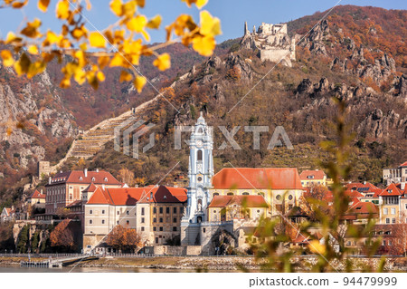 Panorama of Duernstein village with church and castle during autumn in Wachau valley, Austria, UNESCO 94479999