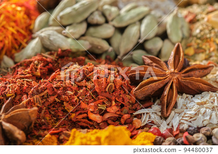 Spices. Aromatic Indian spices on a slate background. Spices and herbs Spices. Aromatic Indian spices on a slate background. Spices and herbs 94480037
