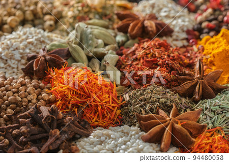 Spices. Aromatic Indian spices on a slate background. Spices and herbs Spices. Aromatic Indian spices on a slate background. Spices and herbs 94480058