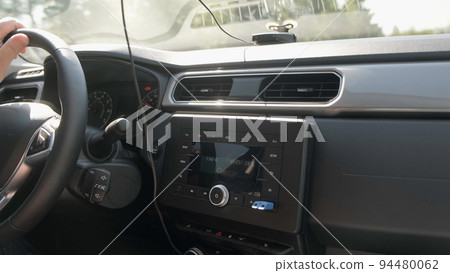Person steering wheel with one hand close up Person steering wheel with one hand close up 94480062