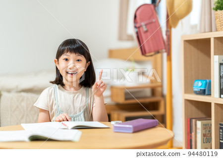 Elementary school girl studying in the children's room 94480119