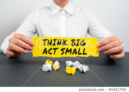 Text sign showing Think Big Act Small. Word Written on Great Ambitious Goals Take Little Steps one at a time 94481709