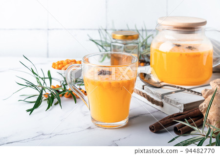 Homemade sea buckthorn tea with honey, ginger and spices Homemade sea buckthorn tea with honey, ginger and spices 94482770