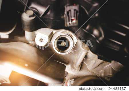 The spark plug socket of a car engine without an ignition coil The spark plug socket of a car engine without an ignition coil 94483187